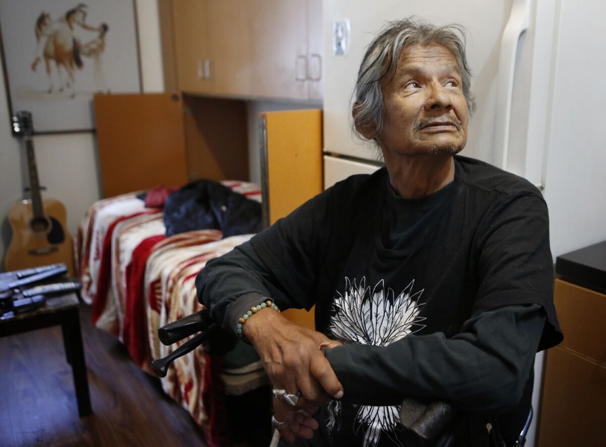 Richard LaRush, 65, in his apartment at Step Up on Second. (Christian K. Lee / Los Angeles Times)