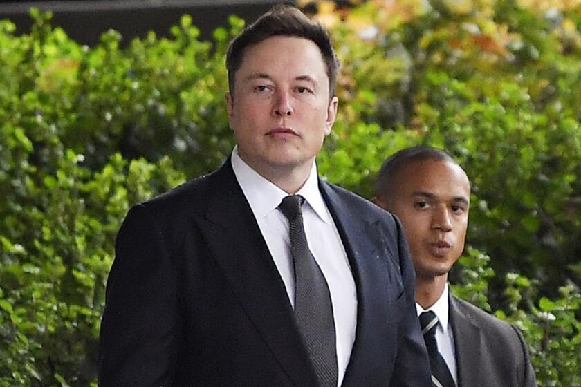FILE - In this Wednesday, Dec. 4, 2019 file photo, Tesla CEO Elon Musk arrives at U.S. District Court in Los Angeles. Musk did not defame a British cave explorer when he called him “pedo guy” in an angry tweet, a Los Angeles jury found Friday, Dec. 6, 2019. (AP Photo/Mark J. Terrill, File)