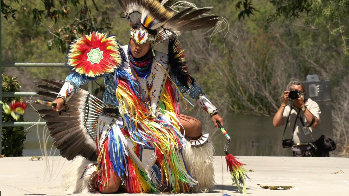 A member of Redboy Productions performs during Sunday's Huntington Beach community picnic.