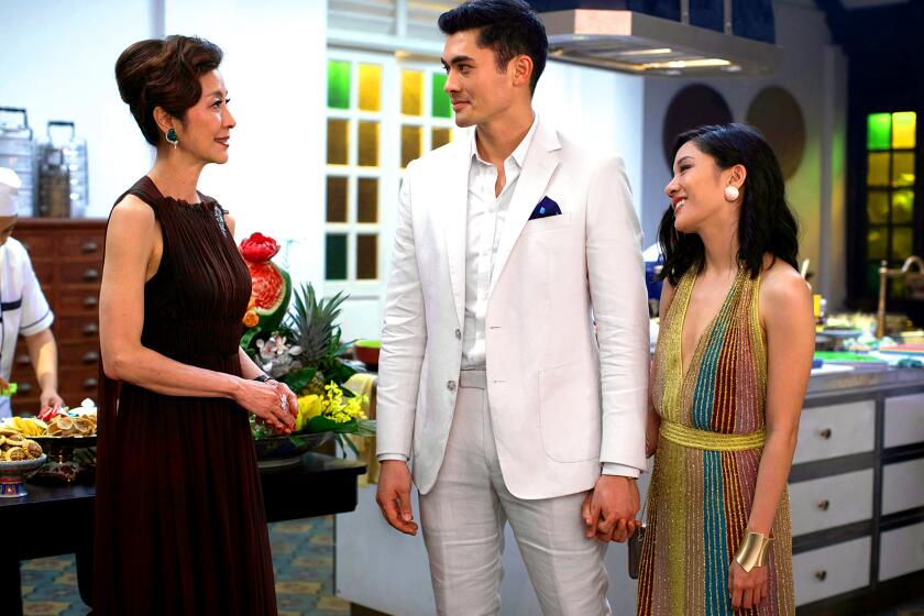 From left, Michelle Yeoh, Henry Golding and Constance Wu star in "Crazy Rich Asians."