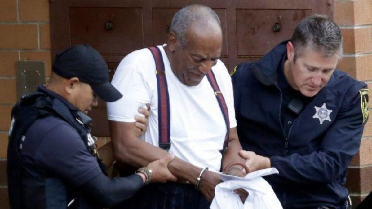 Bill Cosby is led away in handcuffs after he was sentenced to three to 10 years in prison on Sept. 25.