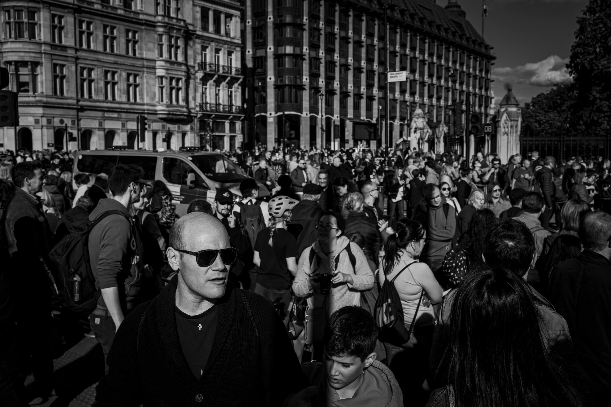 Members of the public gather outside Westminster.