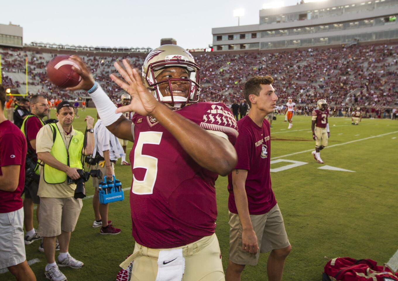 Florida State quarterback Jameis Winston warms up without a care Sept. 20 before the Clemson game ... a game in which he was not allowed to play.