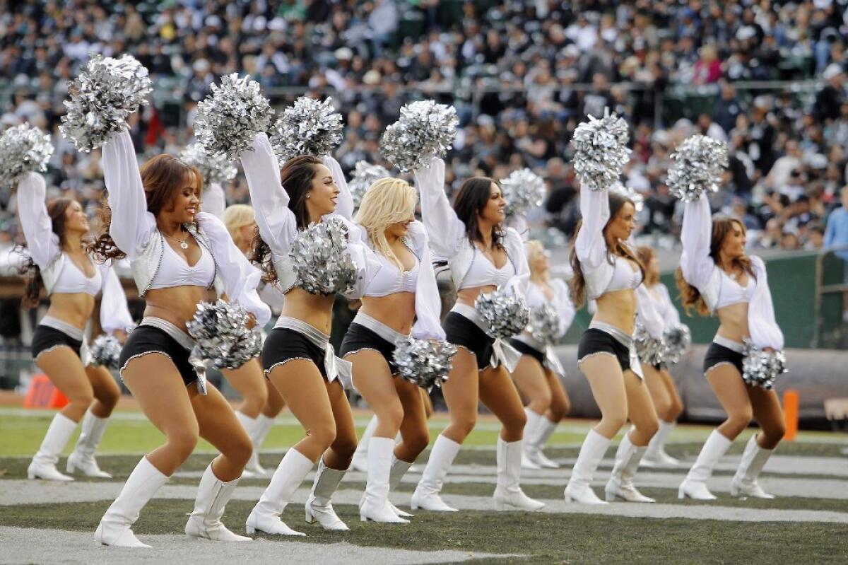 The Raiderettes perform during a timeout between the Philadelphia Eagles and the Oakland Raiders on Nov. 3, 2013, at the Coliseum in Oakland. Two of the cheerleaders are involved in a lawsuit against the team.