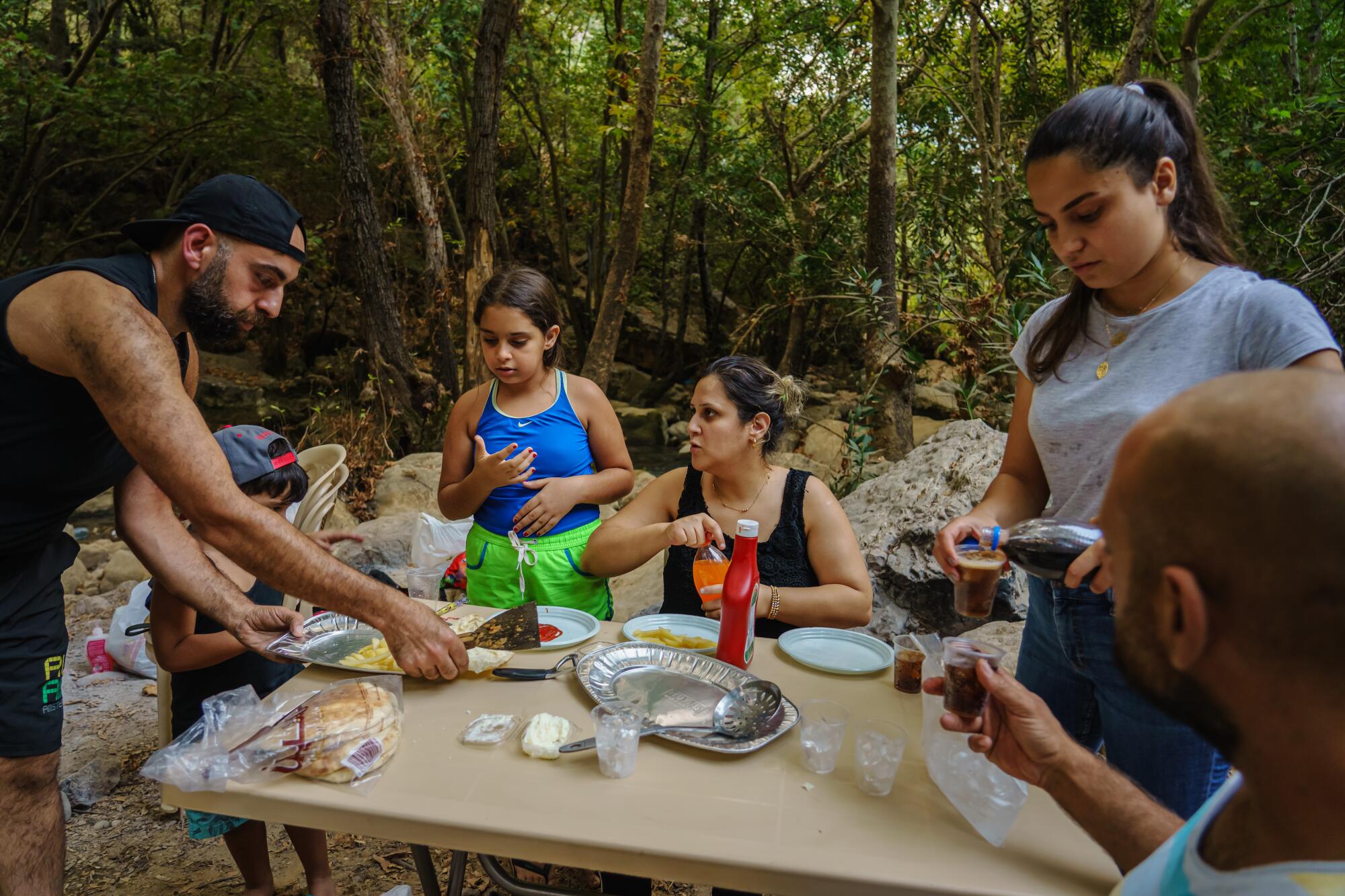 A family picnic along the Awali river in Bisri Valley, Lebanon.