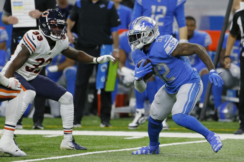 Detroit Lions running back D'Andre Swift (32) rushes during the first half of an NFL football game against the Chicago Bears, Thursday, Nov. 25, 2021, in Detroit. (AP Photo/Duane Burleson)