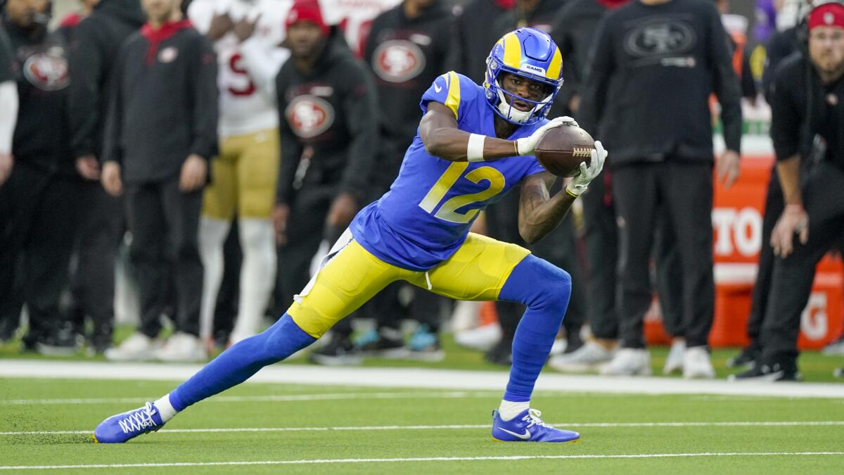 Rams wide receiver Van Jefferson catches a pass during a playoff game against the 49ers.