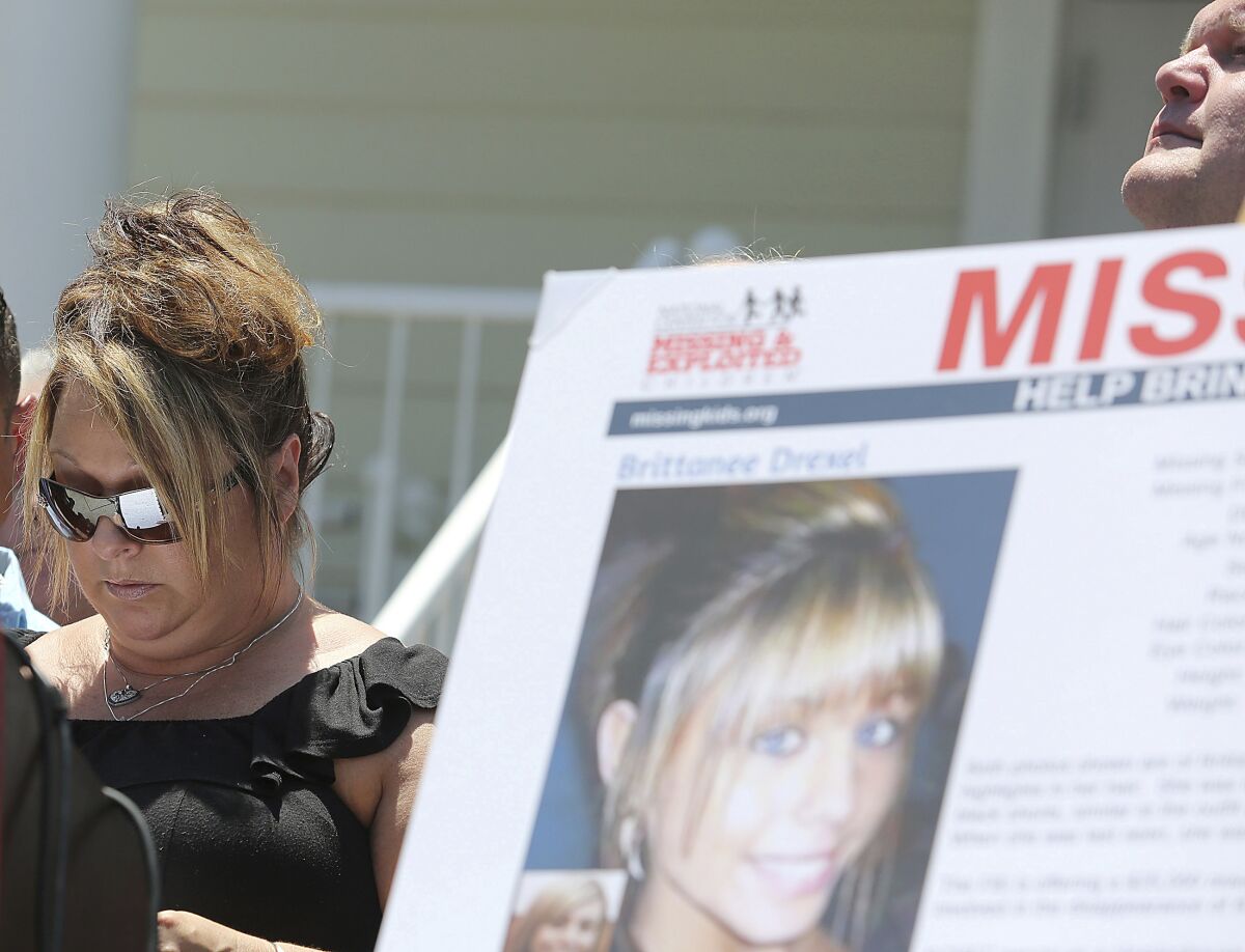 FILE - Dawn Drexel, mother of Britanee Drexel, listens during a news conference in McClellanville, S.C., on Wednesday, June 8, 2016. The body of a 17-year-old girl from New York who disappeared while visiting South Carolina's Myrtle Beach on spring break 13 years ago has been found and a sex offender has been charged with murder, authorities said Monday, May 16, 2022. Drexel was kidnapped by Raymond Douglas Moody, who raped and killed her before burying her body in the woods, Georgetown County Sheriff Carter Weaver said Monday at a news conference. (Janet Blackmon Morgan/The Sun News via AP)