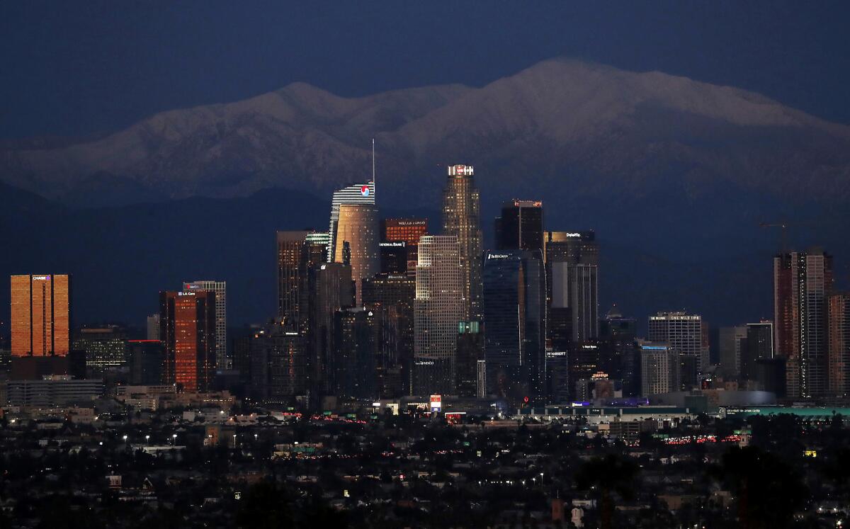 Snow covers the San Gabriel Mountains with downtown L.A. in the foreground in February of 2019