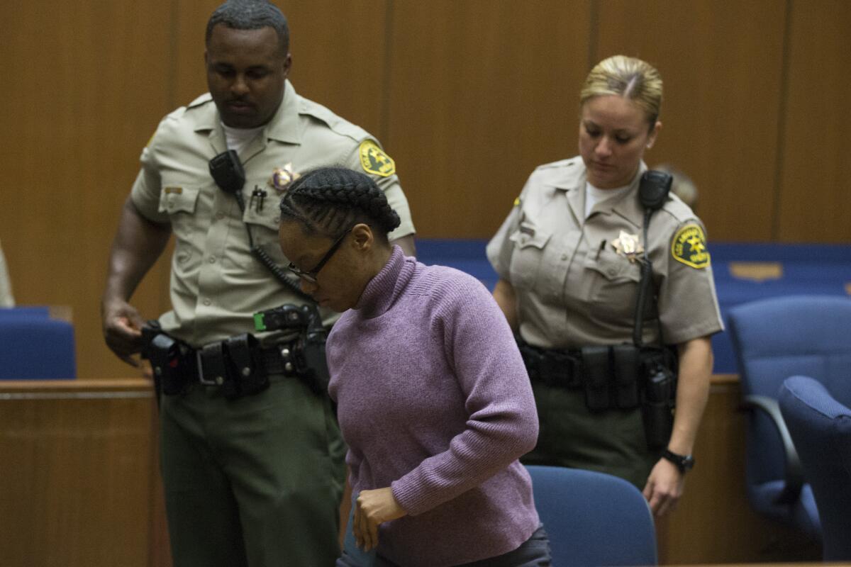 Kiana Barker is led from the courtroom in October after being found guilty of second-degree murder of a 2-year-old girl.