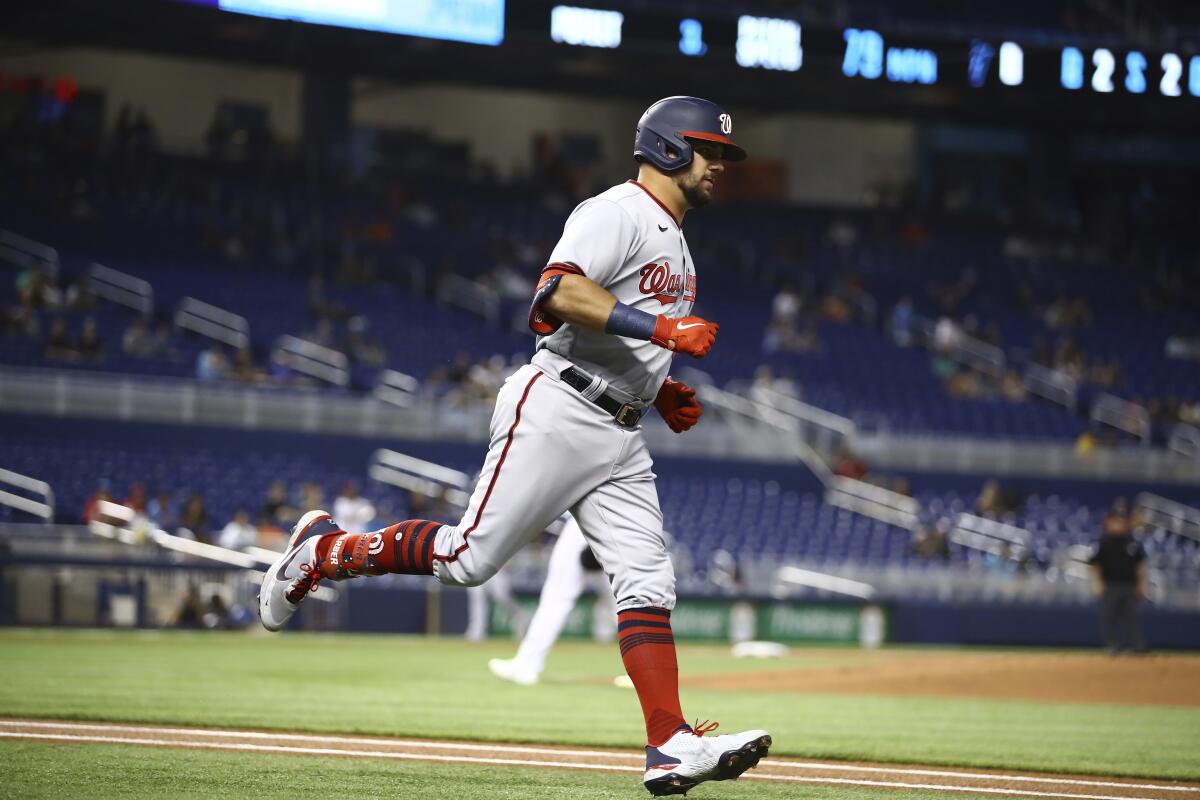 Miami Marlins Adam Duvall (14) runs to first base during a Major