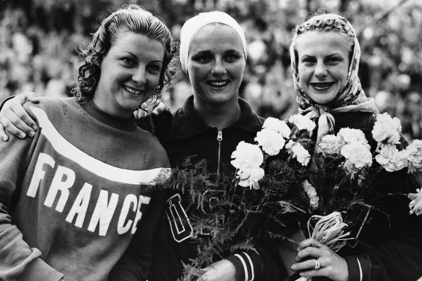 L-R: Madeleine Moreau of France (silver medallist, 139.34 points); Patricia McCormick of USA.