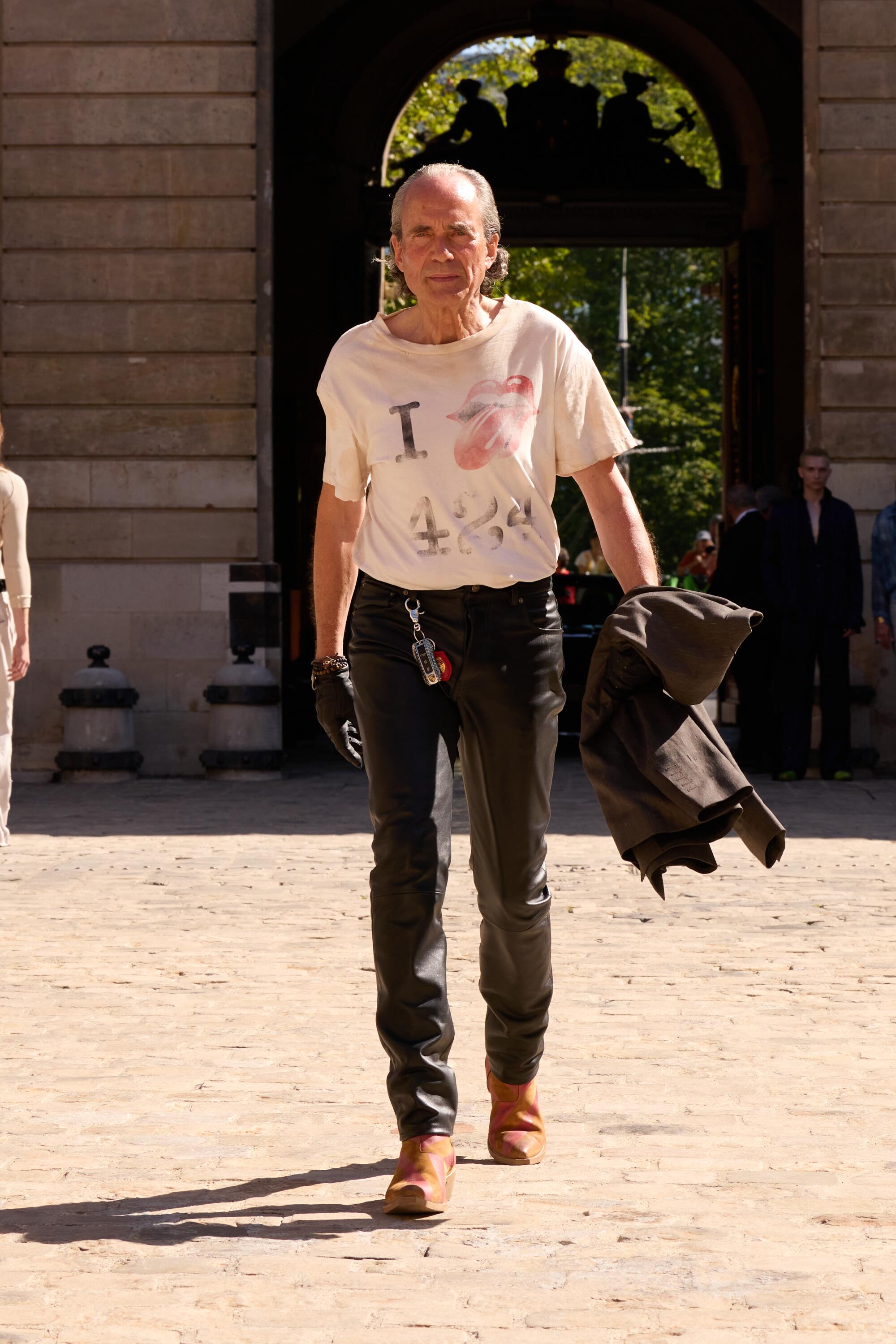 An older model is walking for 424's SS26 runway