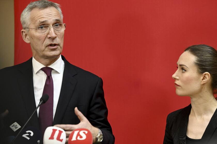 NATO Secretary General Jens Stoltenberg, left, and Finnish Prime Minister Sanna Marin meet the press before SAMAK's annual meeting in Helsinki, Finland, Tuesday, Feb. 28, 2023. SAMAK is the Cooperation Committee of the Nordic Social Democratic parties and trade union LOs. (Heikki Saukkomaa/Lehtikuva via AP)