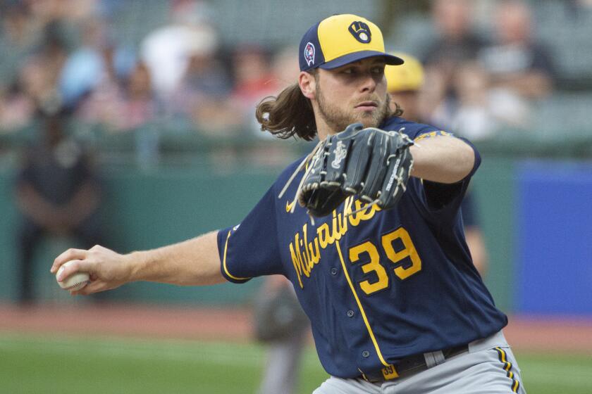 Milwaukee Brewers starting pitcher Corbin Burnes delivers against the Cleveland Indians.