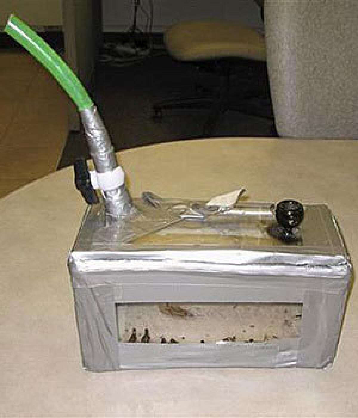 A homemade bong, consisting of a piece of garden hose attached to a duct-taped plexiglas box, is seen in this March 1, 2009, handout photo provided by the Lancaster County Sheriff's Dept.