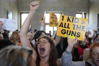 Emmie Wolf-Dubin, center, yells during a protest outside the House chamber after legislation passed that would allow some teachers to be armed in schools during a legislative session Tuesday, April 23, 2024, in Nashville, Tenn. (AP Photo/George Walker IV)