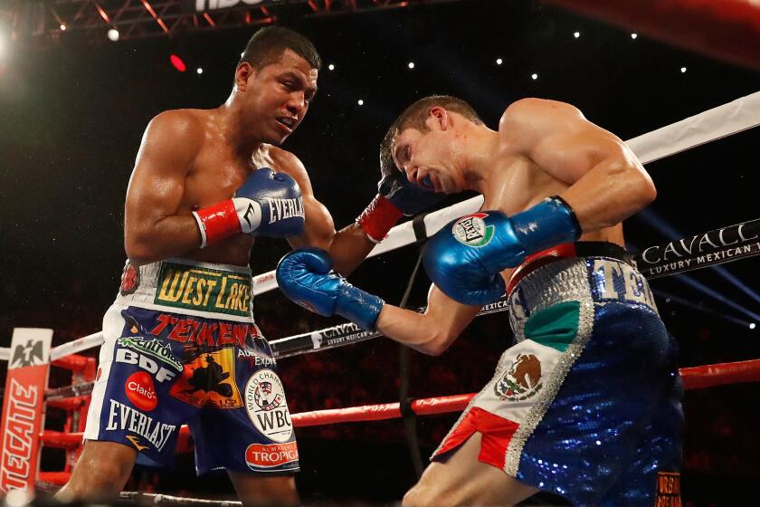 Roman "Chocolatito" Gonzalez, left, defeated Carlos Cuadras by unanimous decision Saturday at The Forum.