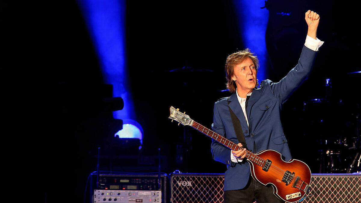 Paul McCartney greets the sold-out Dodger Stadium crowd before performing in Los Angeles Aug. 10.