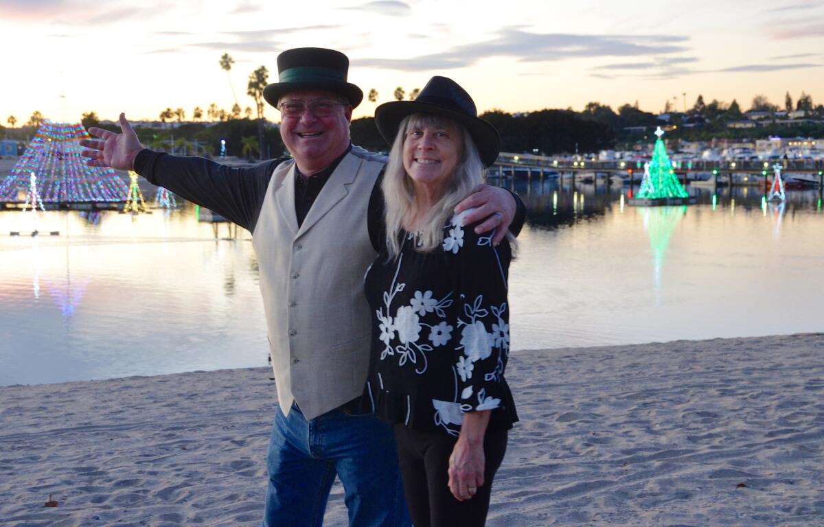 General manager of Newport Dunes & Waterfront Resort, Phil Ravenna, and wife Sandy at the Lighting of the Bay on Friday.