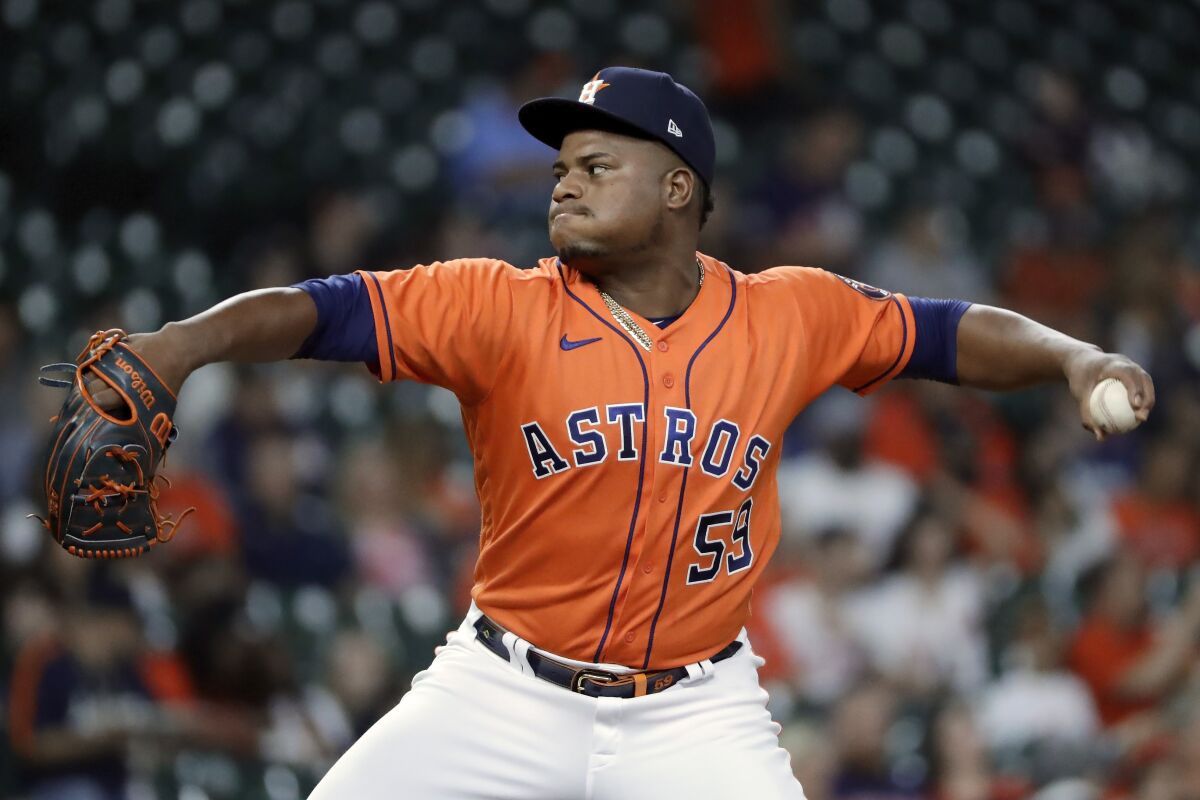 Houston Astros starting pitcher Framber Valdez (59) throws against the Oakland Athletics during the first inning of a baseball game Friday, Oct. 1, 2021, in Houston. (AP Photo/Michael Wyke)