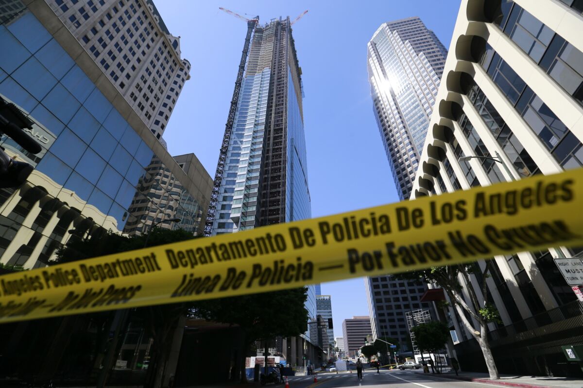 A construction worker died Thursday after falling from a high-rise building in downtown Los Angeles.