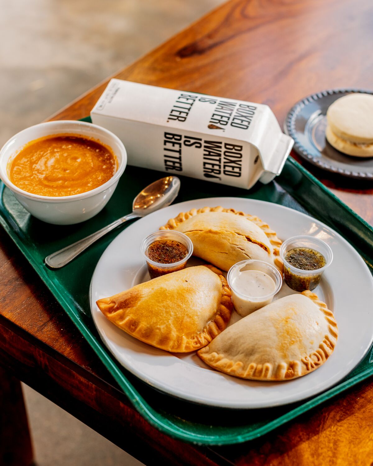 The lunch combo includes three empanadas, a drink and side of soup or salad