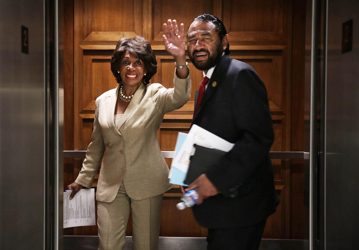 Rep. Al Green (D-Texas), shown entering a Capitol Hill elevator in 2013 with Rep. Maxine Waters (D-Los Angeles), is forcing a House vote on his impeachment resolution Wednesday.