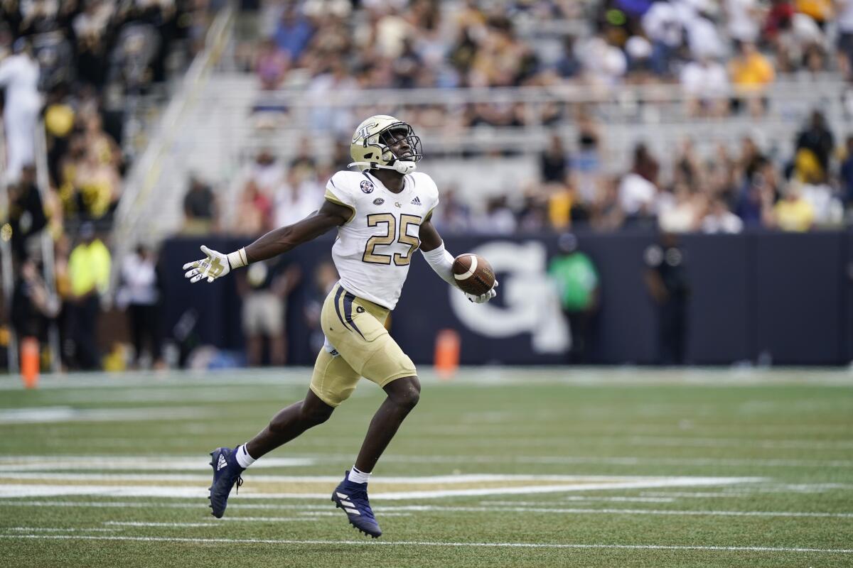 Georgia Tech linebacker Charlie Thomas (25) celebrates after making an interception in the second half of an NCAA college football game against Kennesaw State, Saturday, Sept. 11, 2021, in Atlanta. (AP Photo/Brynn Anderson)
