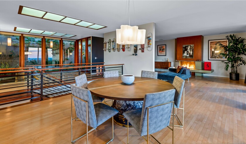 The hillside home includes three levels of decks, balconies and patios, as well as a swimming pool and spa.