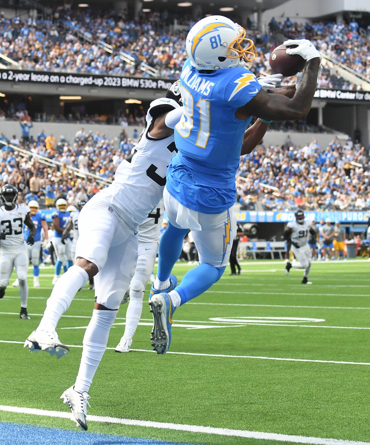 Chargers receiver Mike Williams catches a touchdown pass next to Jaguars cornerback Tyson Campbell in the second quarter.