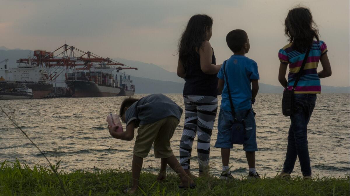 A ship berthed in the Philippine port of Subic Bay, north of Manila, is loaded with waste to be sent back to Canada.