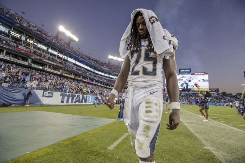 NASHVILLE, TN, SUNDAY, OCTOBER 20, 2019 - Los Angeles Chargers running back Melvin Gordon (25) leaves the field, dejected after fumbling at the goal line while trying to score a winning touchdown against the Tennessee Titans at Nissan Stadium. (Robert Gauthier/Los Angeles Times)