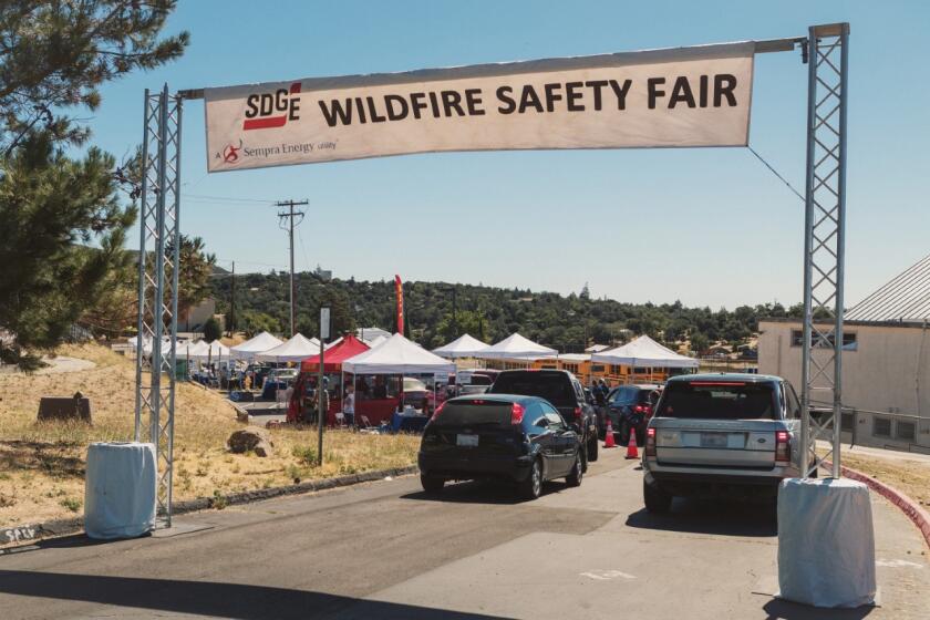 Customers take part in a San Diego Gas & Electric Drive-Thru Wildfire Safety Fair.