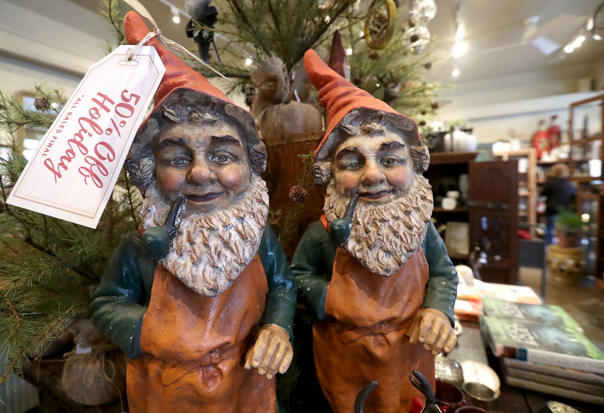 Two holiday gnomes on display at the AREO store in downtown Laguna Beach on Dec. 29.