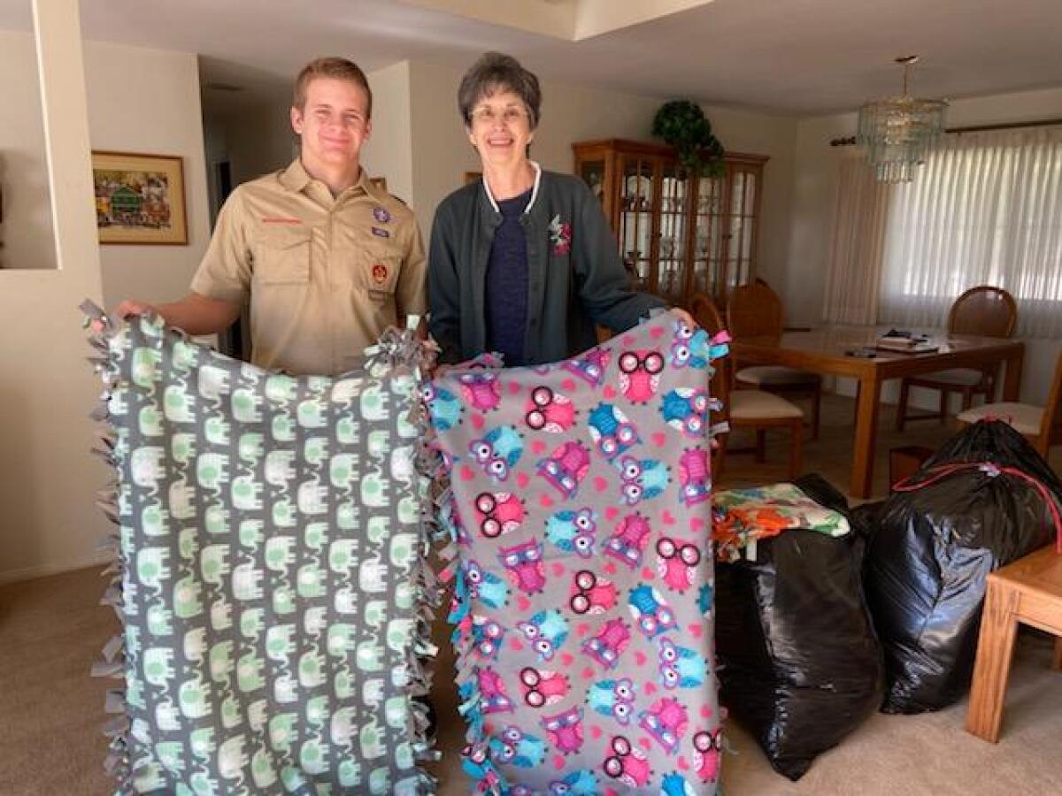 The Women’s Club of Vista has worked with the Vista Community Clinic since 2017, bringing in hand sewn teddy bears for pediatric patients, and plush blankets and knitted hats for newborns. They call their projects “covers of love.” So when Boy Scout Ryan Bostwick (now an Eagle Scout) contacted the club looking for a way to help the community as part of his Eagle Scout project, the group suggested making "Covers of Love" for newborn patients at the Vista Community Clinic. Ryan, 16, raised money to buy all of the necessary materials and gathered volunteers to make the soft covers. He and his team made 50 fleece blankets to donate, all with different patterns and colors. From left, Eagle Scout Ryan Bostwick and Women’s Club of Vista member, Nancy Ellis. Visit womansclubofvista.org and vcc.org.