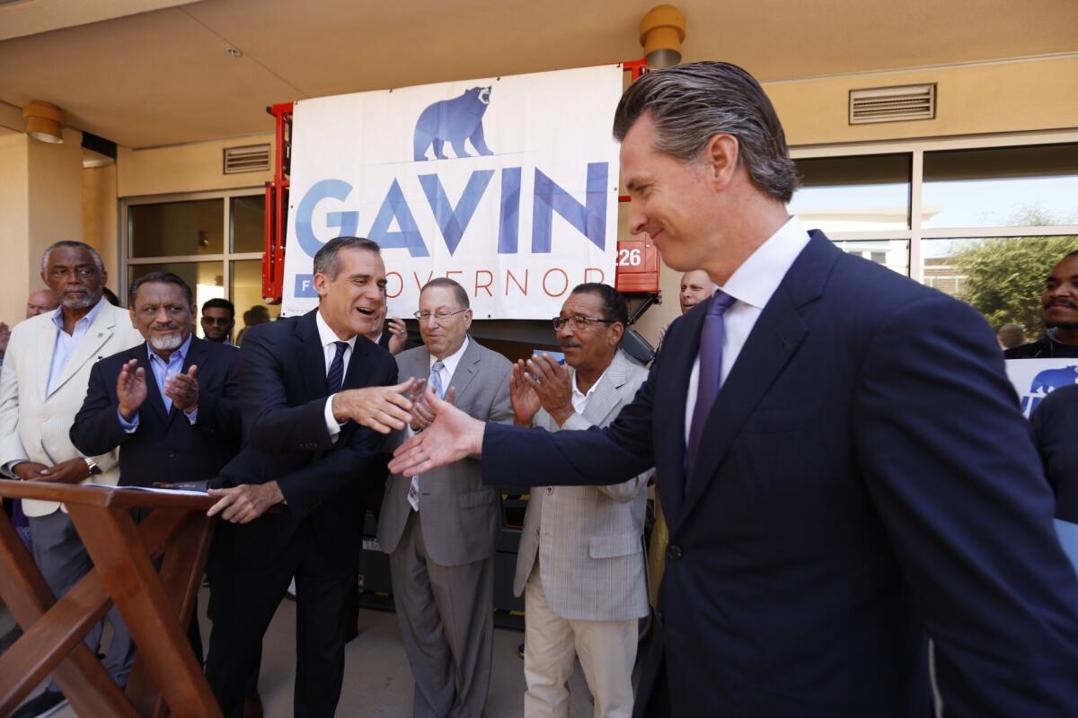 Gubernatorial candidate Lt. Gov. Gavin Newsom receives an endorsement from Los Angeles Mayor Eric Garcetti on Friday.