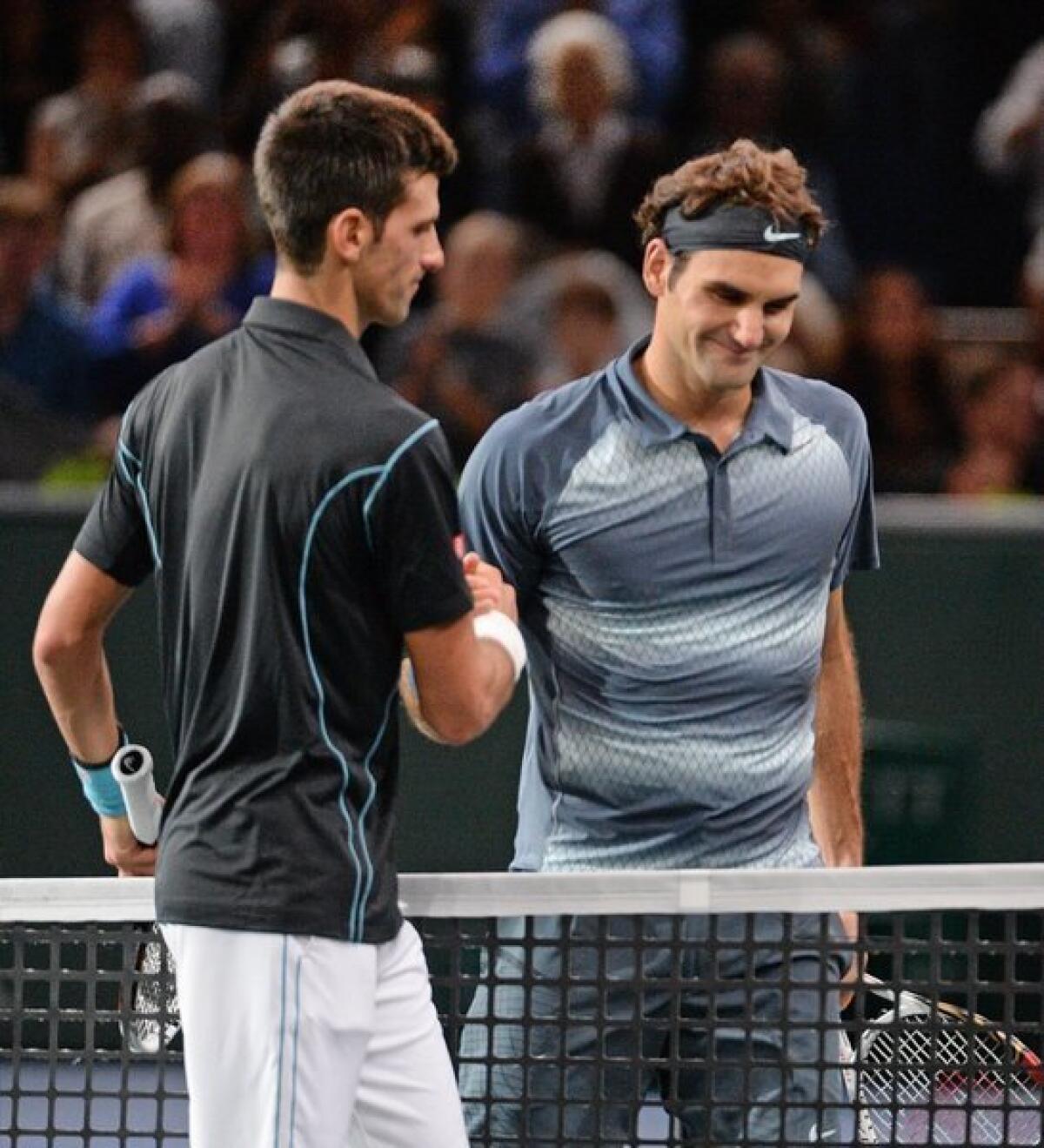 Novak Djokovic, left, says Roger Federer isn't as fast as he used to be.