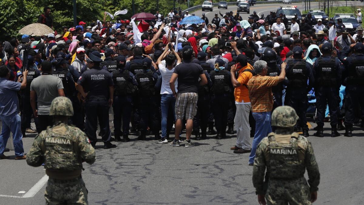Mexican authorities stop a migrant caravan that had crossed the Mexico-Guatemala border, near Metapa, Chiapas state, Mexico, June 5, 2019.