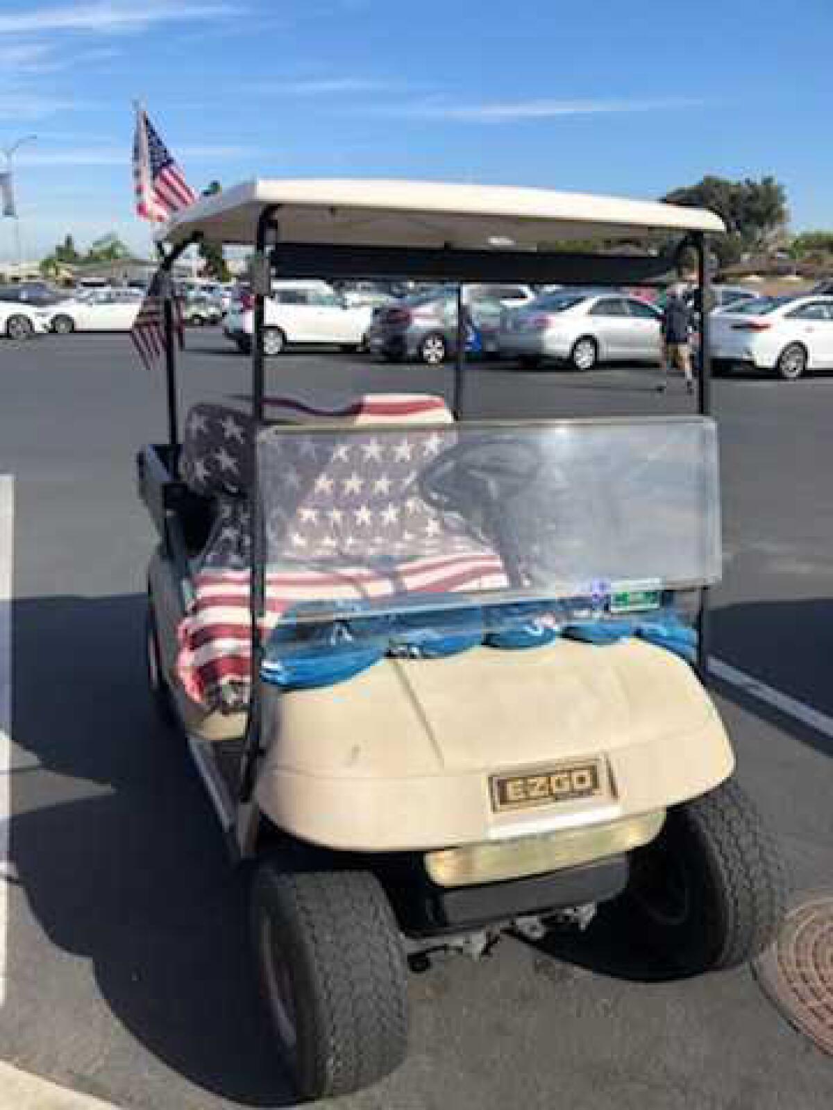 A golf cart with a Stars and Stripes-themed covering at Leisure World in Seal Beach.