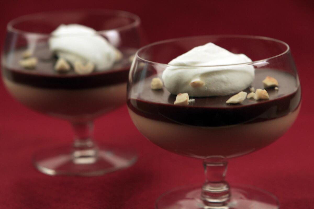Caramel budino layered with chocolate ganache, served with whipped sour cream and toasted nuts.