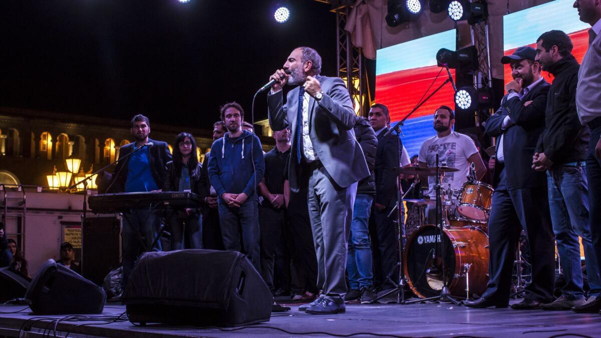 Armenian protest leader Nikol Pashinian, center, addresses a crowd gathered in Republic Square in Yerevan, Armenia.