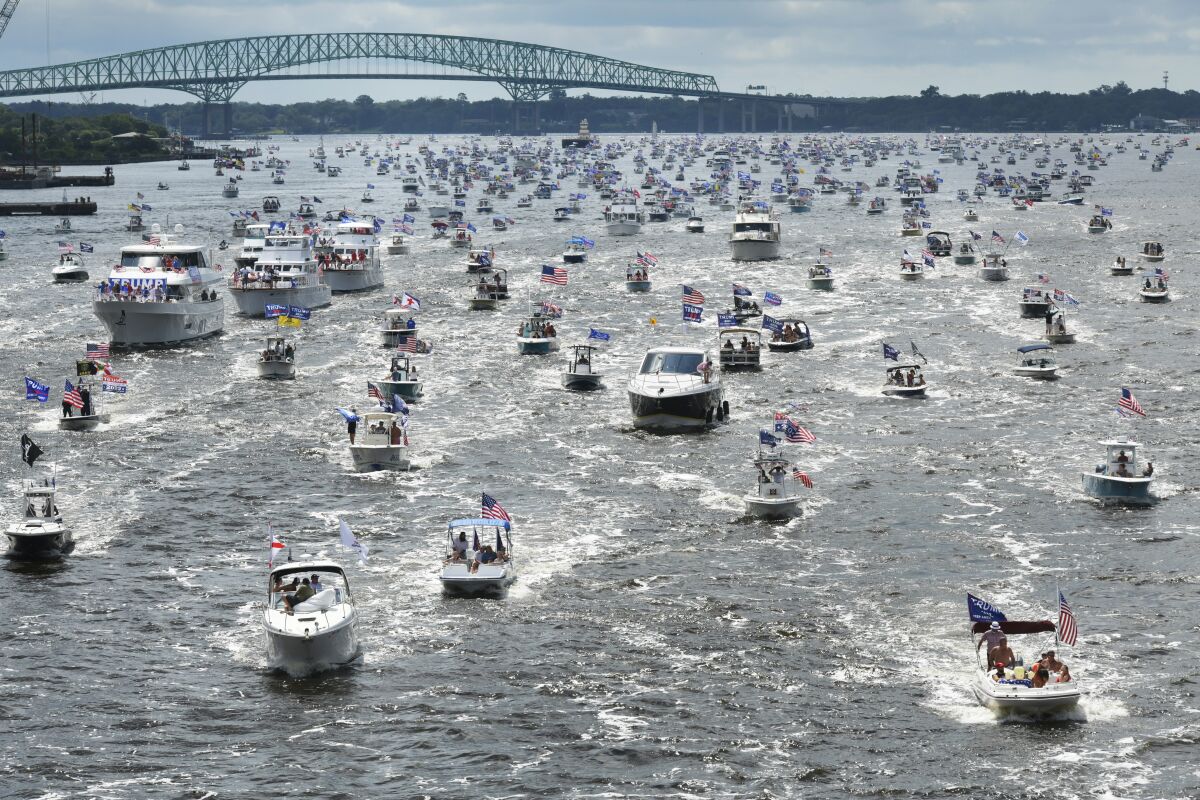 Boats idle on the St. Johns River in Jacksonville, Fla., during a rally Sunday to celebrate President Trump's birthday.