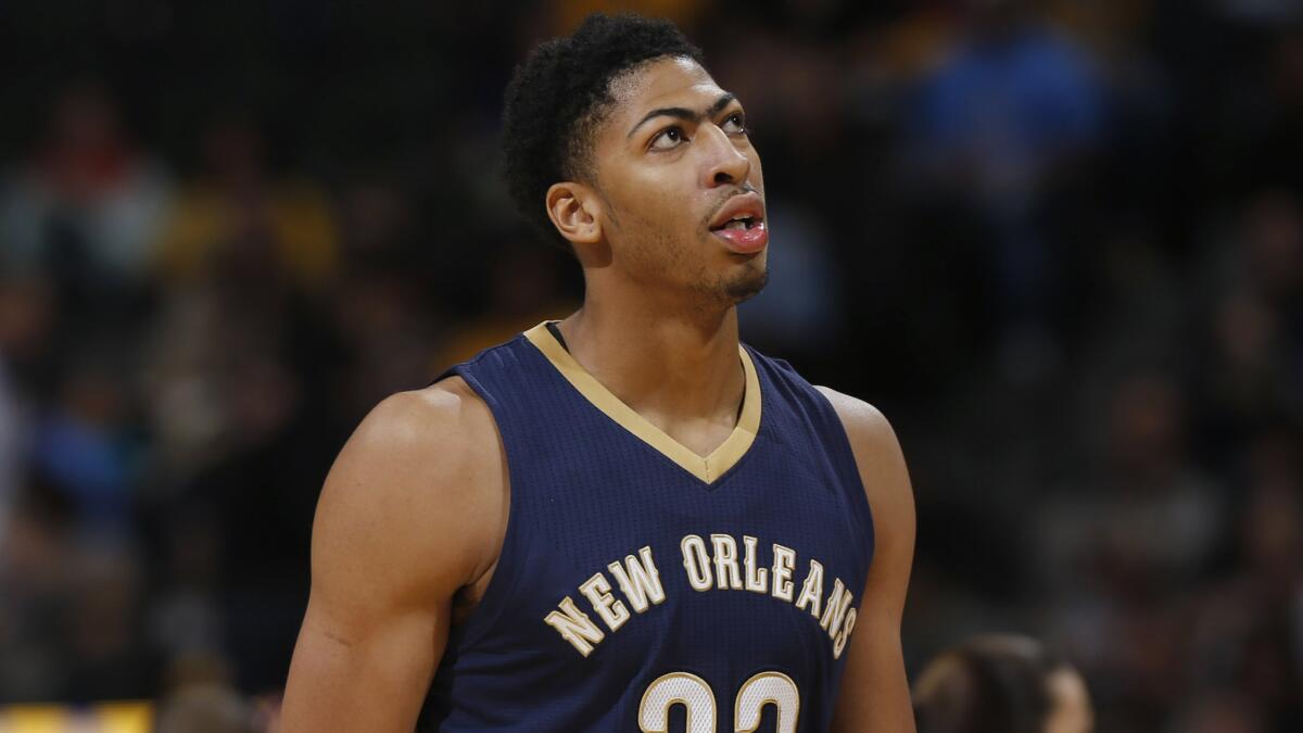 New Orleans Pelicans forward Anthony Davis heads to bench during a game against the Denver Nuggets on Nov. 21.
