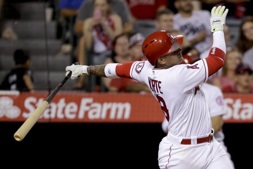 Angels infielder Jefry Marte watches his three-run home run during the sixth inning against the Athletics.