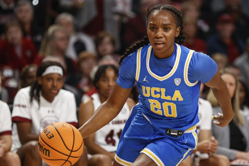 UCLA guard Charisma Osborne drives the baseline against South Carolina.