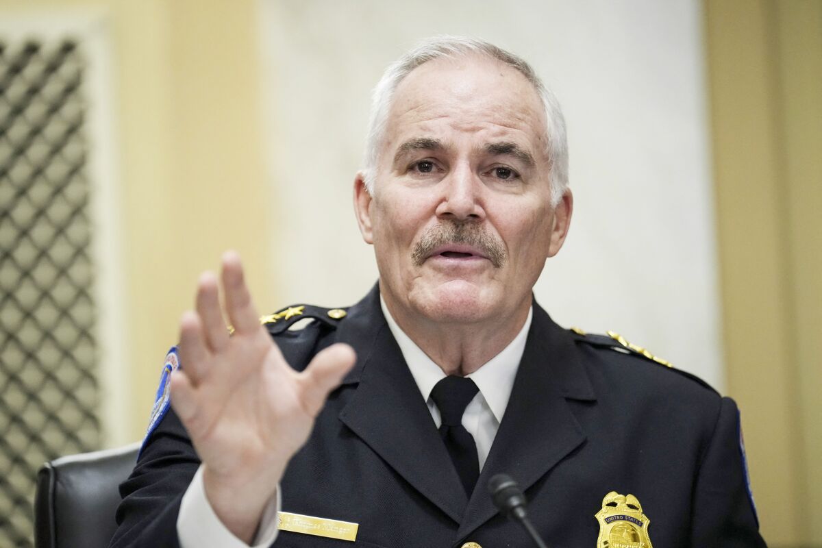 Capitol Police Chief J. Thomas Manger raises his hand and speaks during a Senate hearing