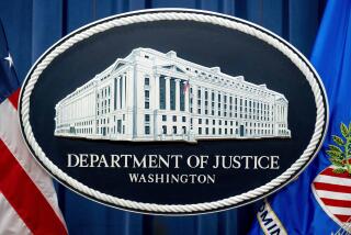FILE - A U.S. Department of Justice sign is seen, Nov. 18, 2022, in Washington. The U.S. Justice Department says a former CIA employee and senior official at the National Security Council has been charged with serving as a secret agent for South Korea’s intelligence service. (AP Photo/Andrew Harnik, File)