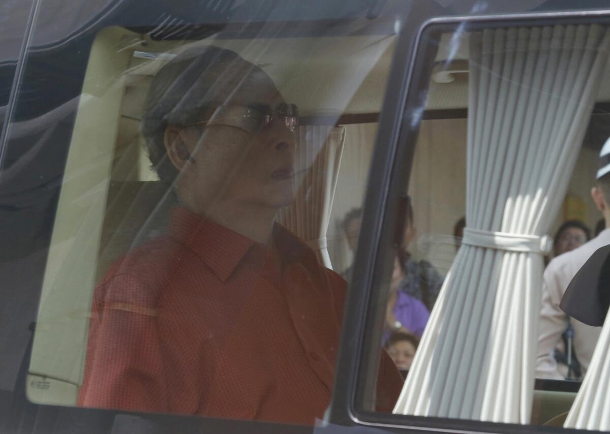 King Bhumibol Adulyadej of Thailand returns to the palace in Bangkok on May 10, 2015, after surgery to remove gallbladder.