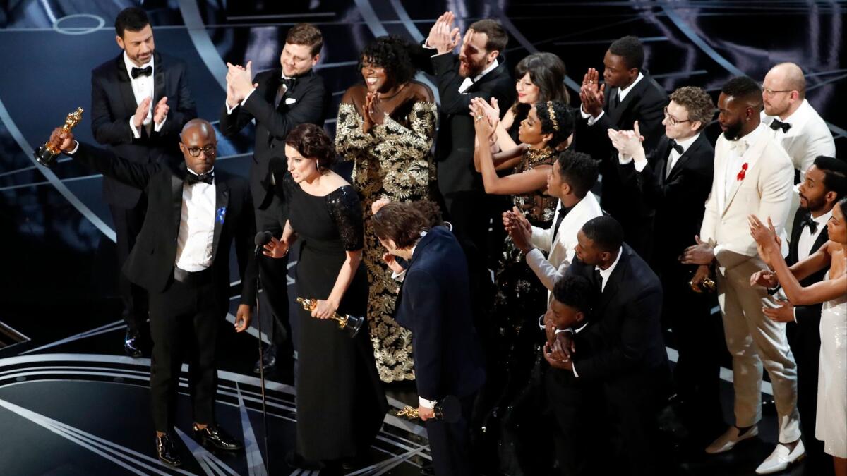 Barry Jenkins accepts the Oscar as "Moonlight" wins for best picture during the telecast of the 89th Academy Awards.